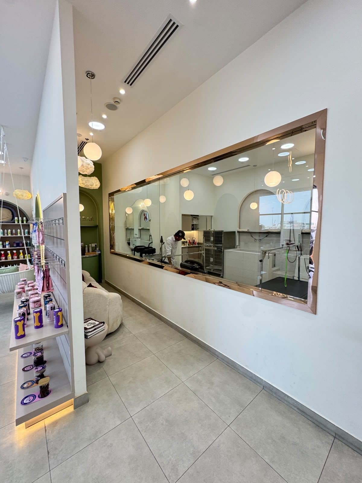 The copper-framed window looking into the Arjan grooming room