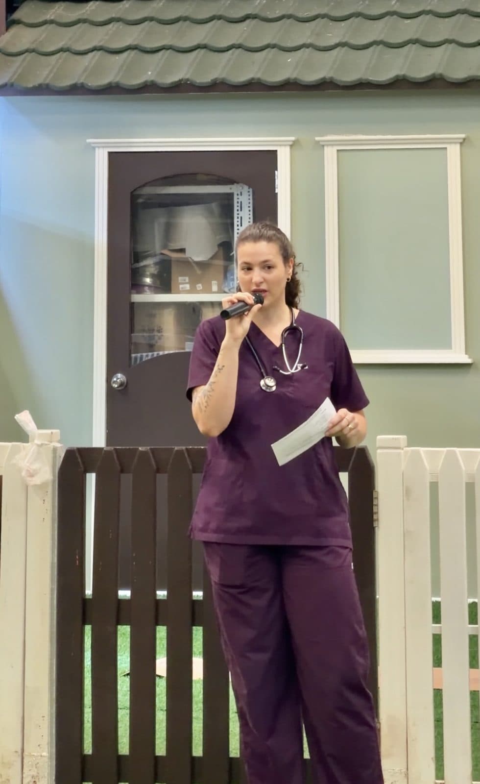 A Canadian Vet Clinic vet giving a talk with a microphone
